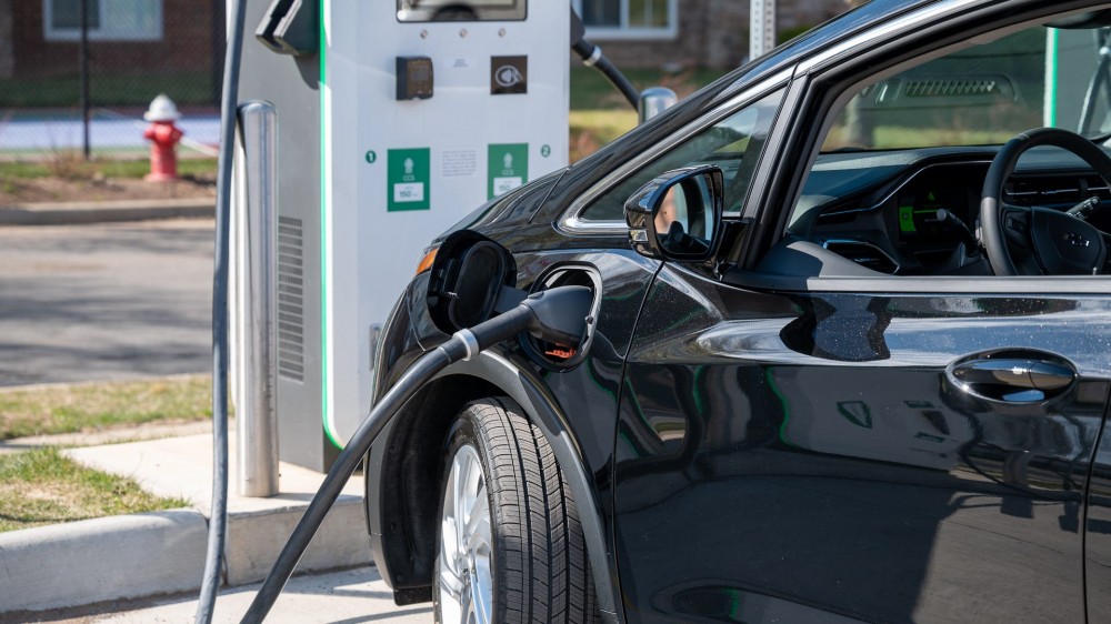 Chevy Bolt EV with an Electrify America charger plugged in